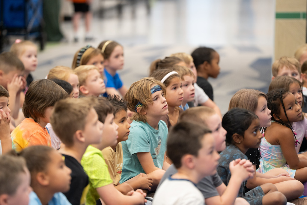student listening in a crowd
