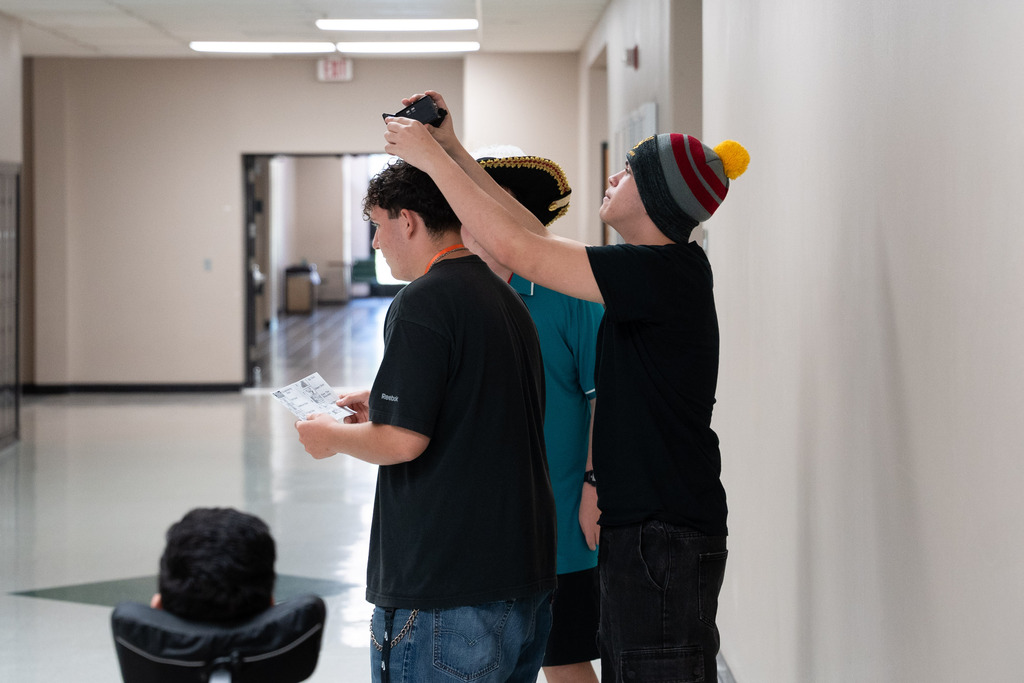 boys filming a shot overhead