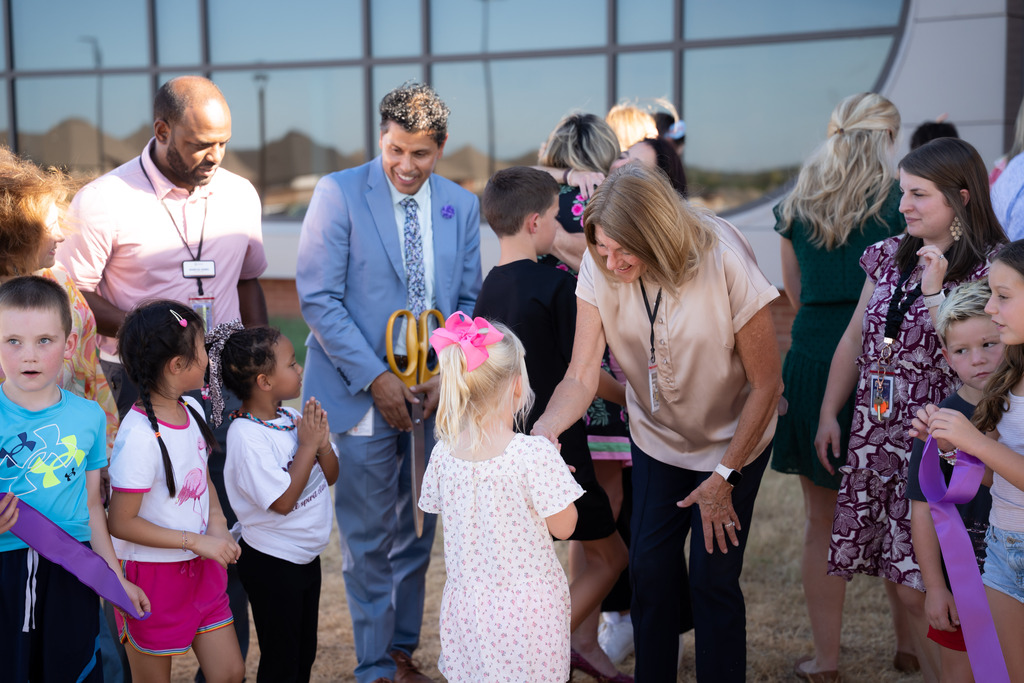 board member talking to a student