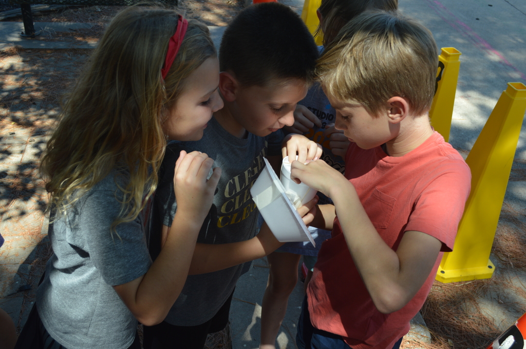 Fourth Graders checking their egg after its drop.