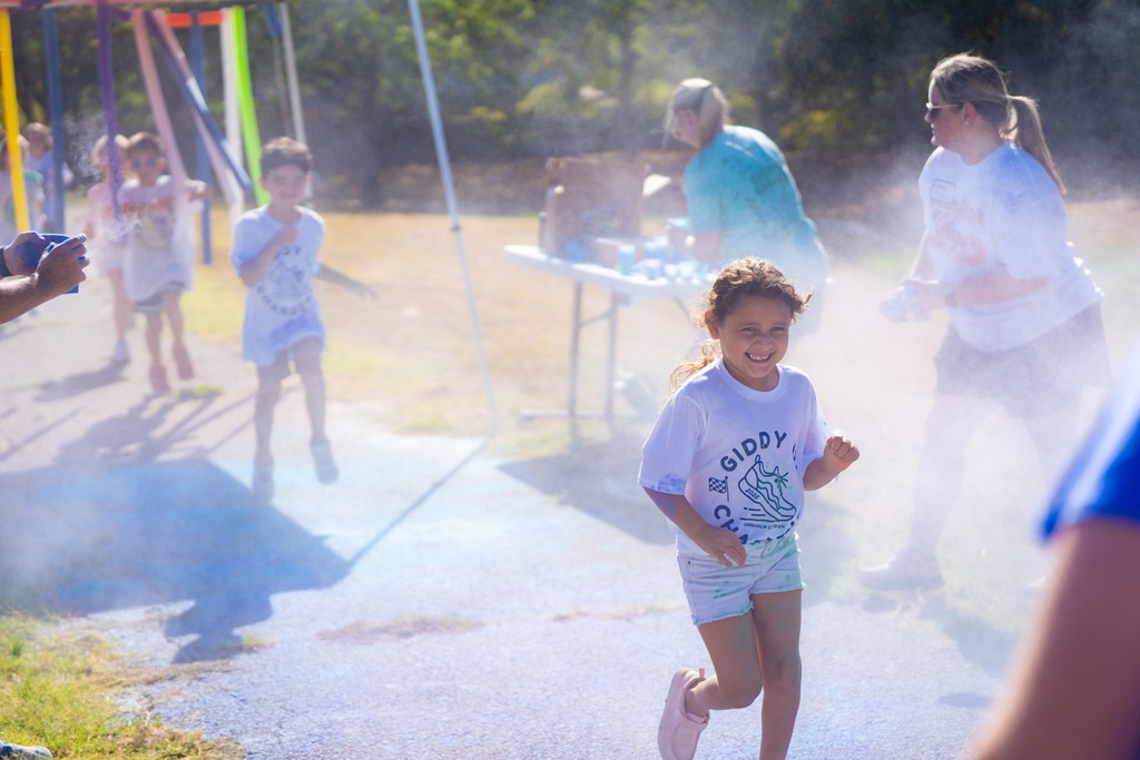student running in a color run