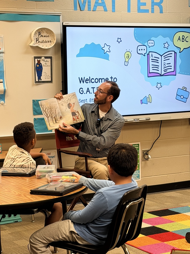 Gentleman reading book to class