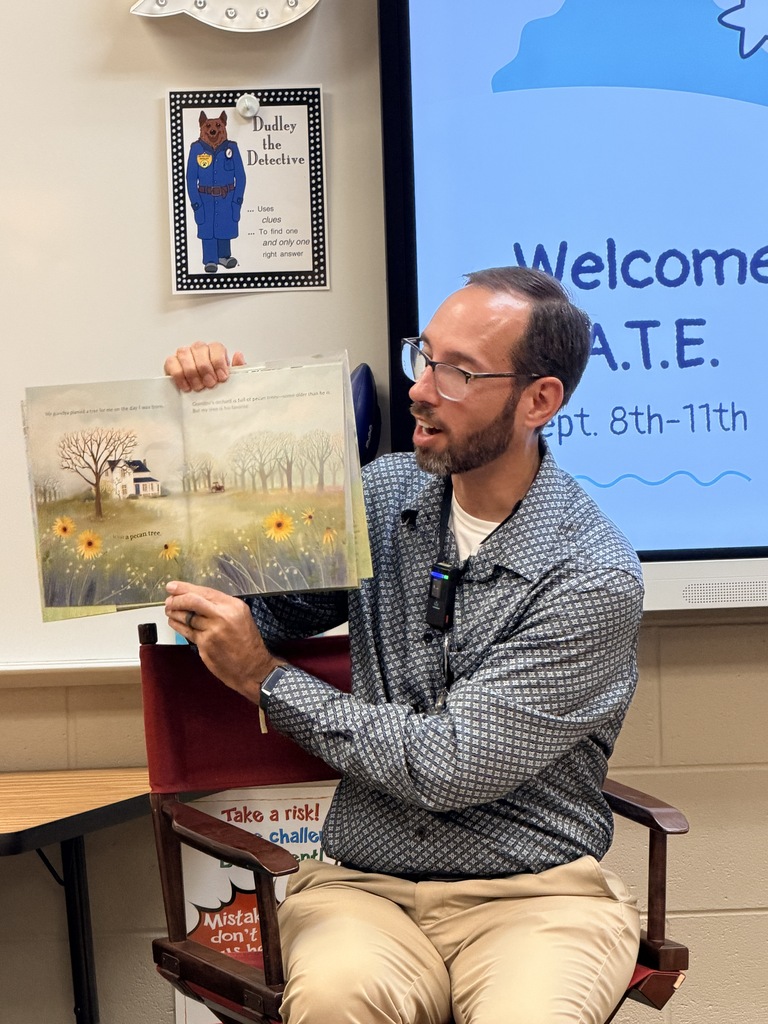 Gentleman reading book to class