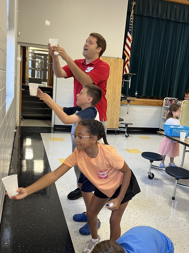 Students playing games at the summer reading party.