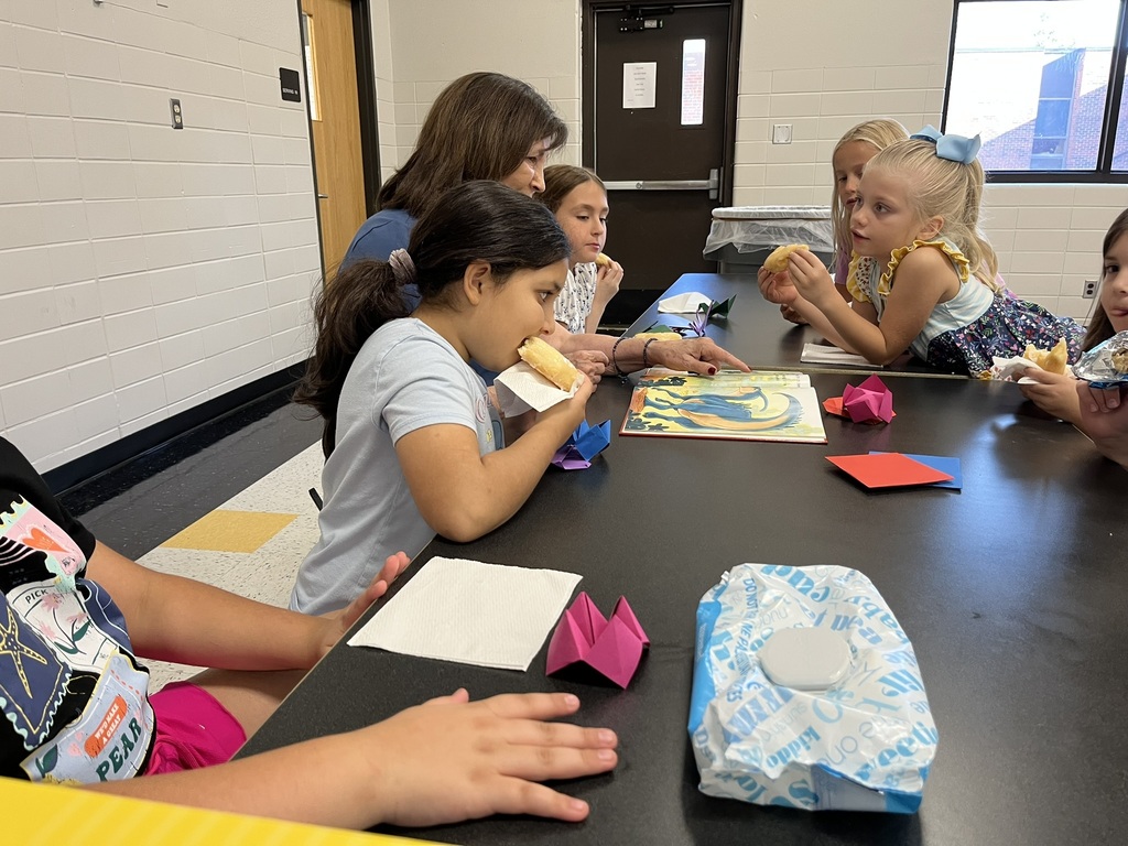 Students listening to a story at the summer reading party.