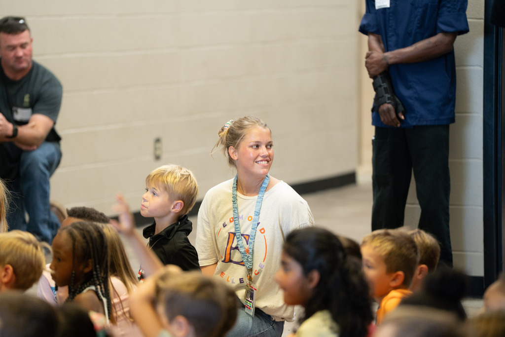teacher looking away and smiling