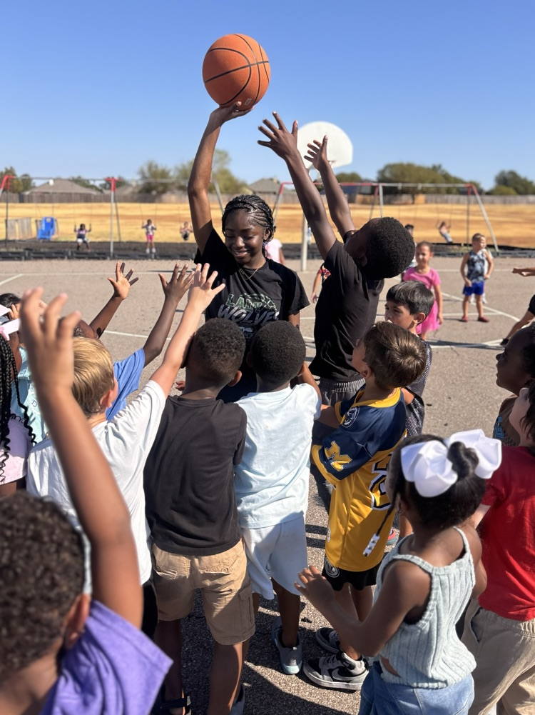 basketball player with kids at recess