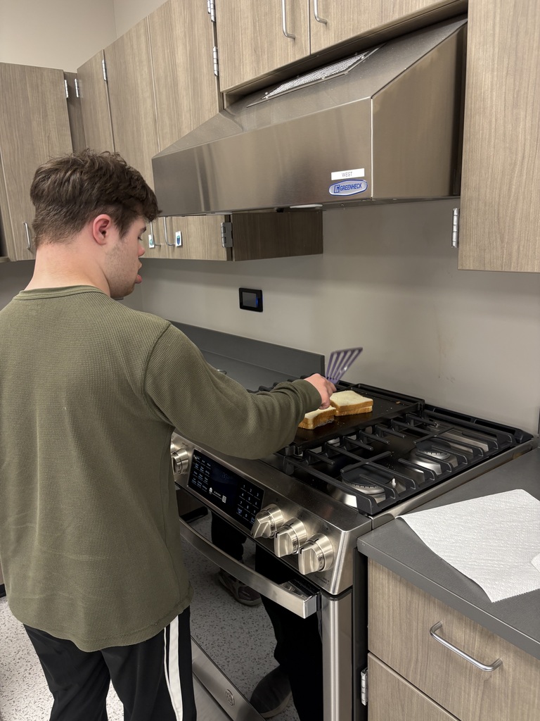 Intern making a grilled cheese 