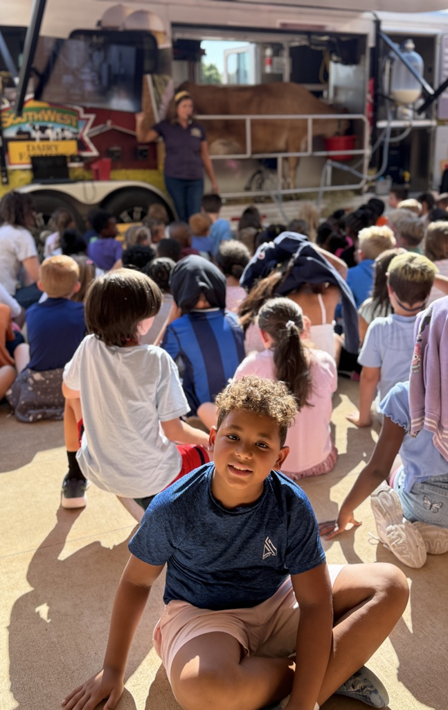 student in front of mobile dairy truck 