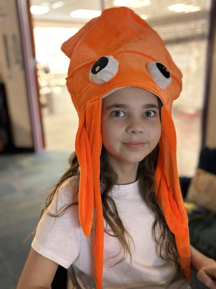 fifth grader and her hat 