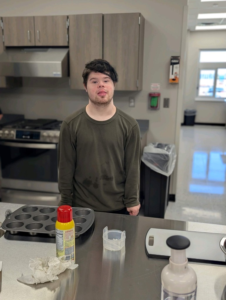 Intern getting ready to cook with a hairnet on