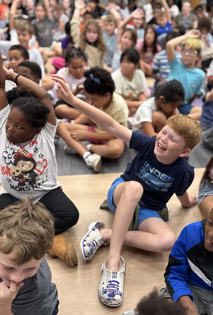 student raising hand for question 