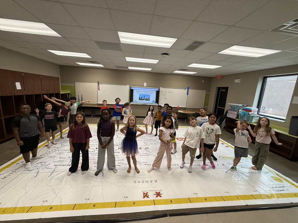 students learning about Oklahoma and super large floor map