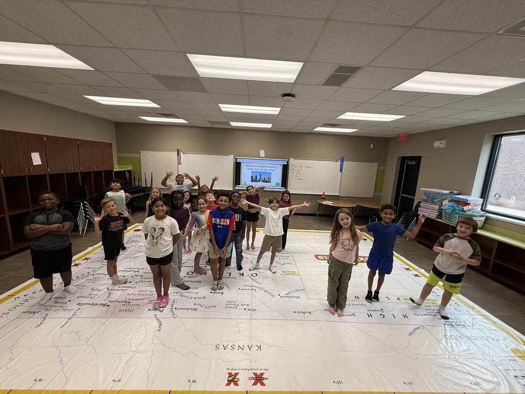 students learning about Oklahoma and super large floor map