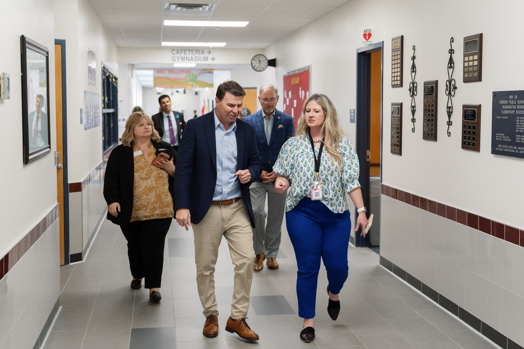 state superintendent walking with principal