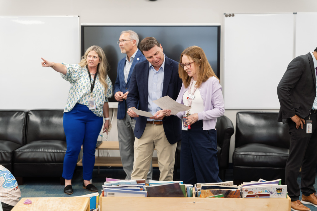 state superintendent working with teacher