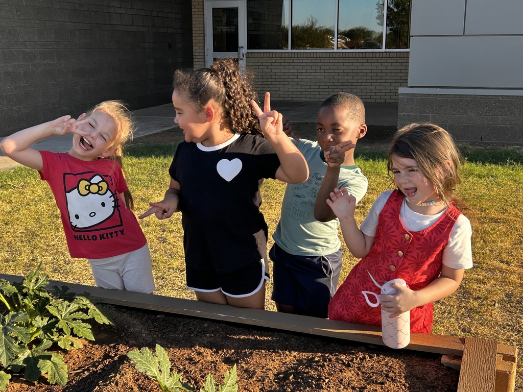 Kindergarten students observing our school garden.