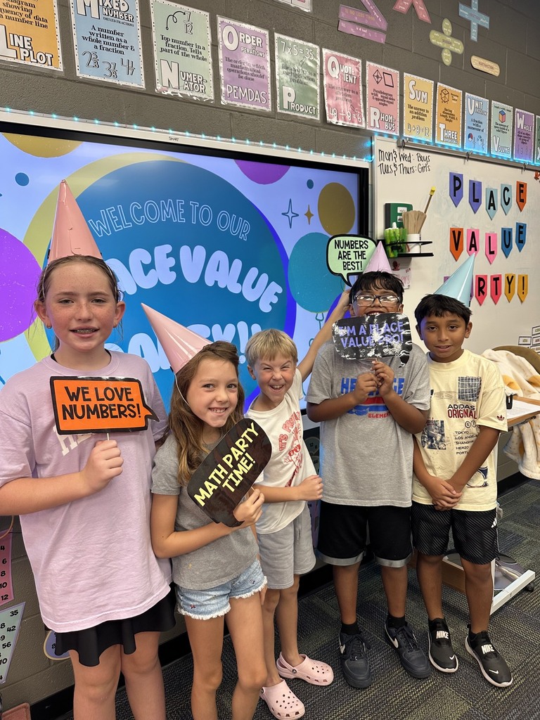 kids holding signs about math