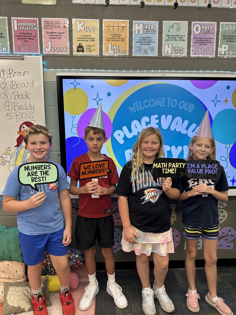 kids holding signs about math