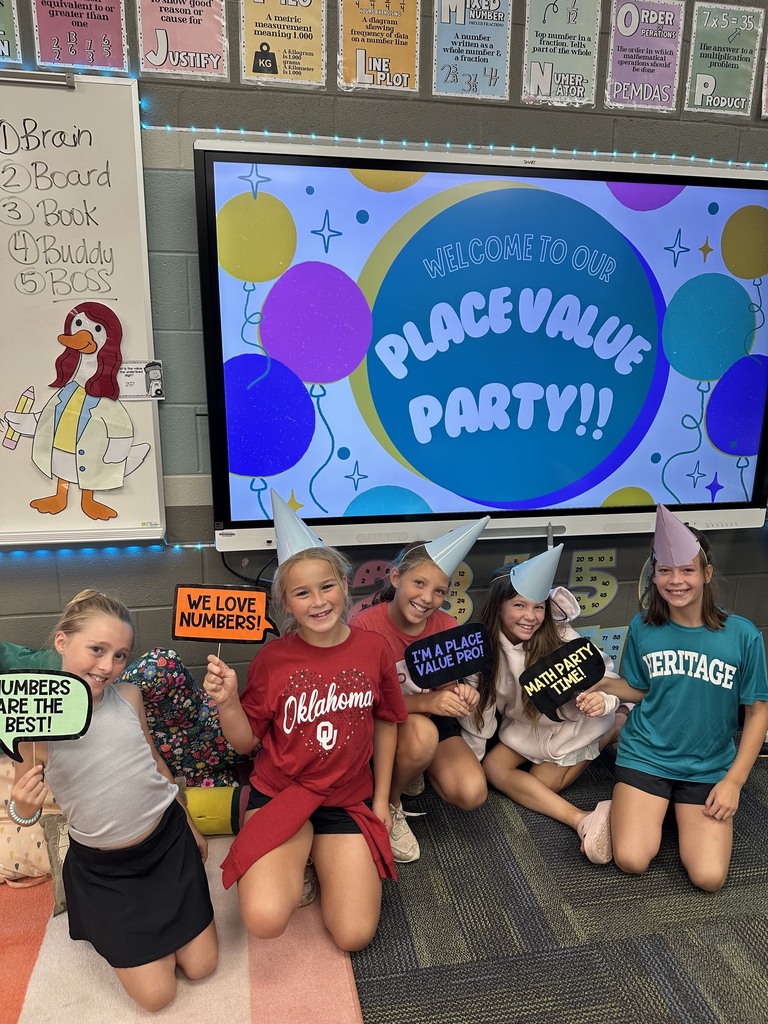 kids holding signs about math