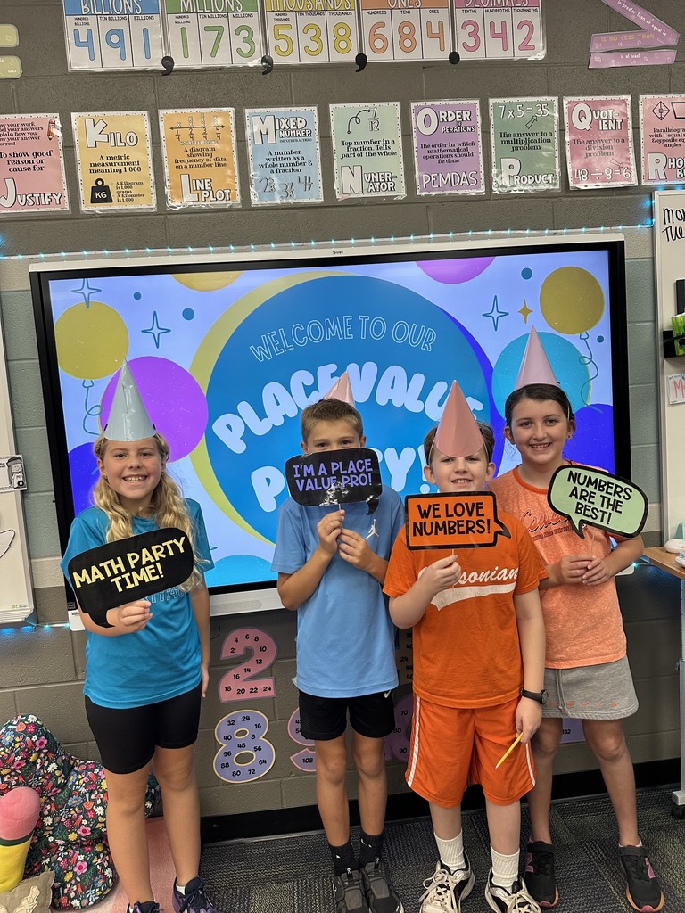 kids holding signs about math
