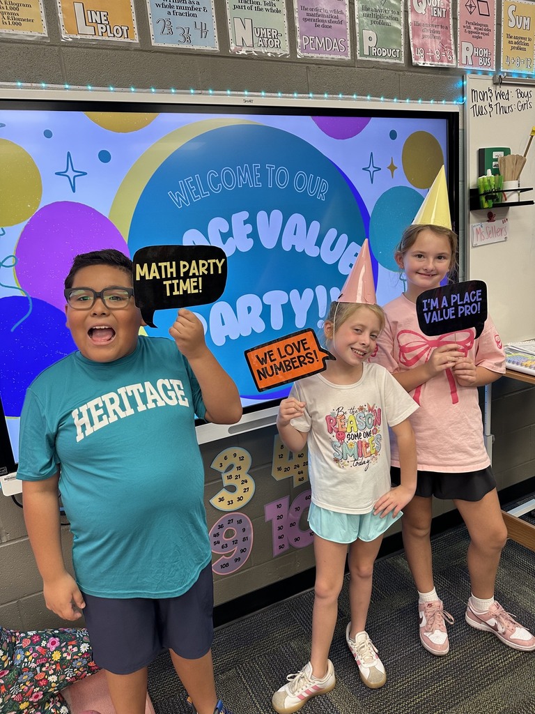 kids holding signs about math