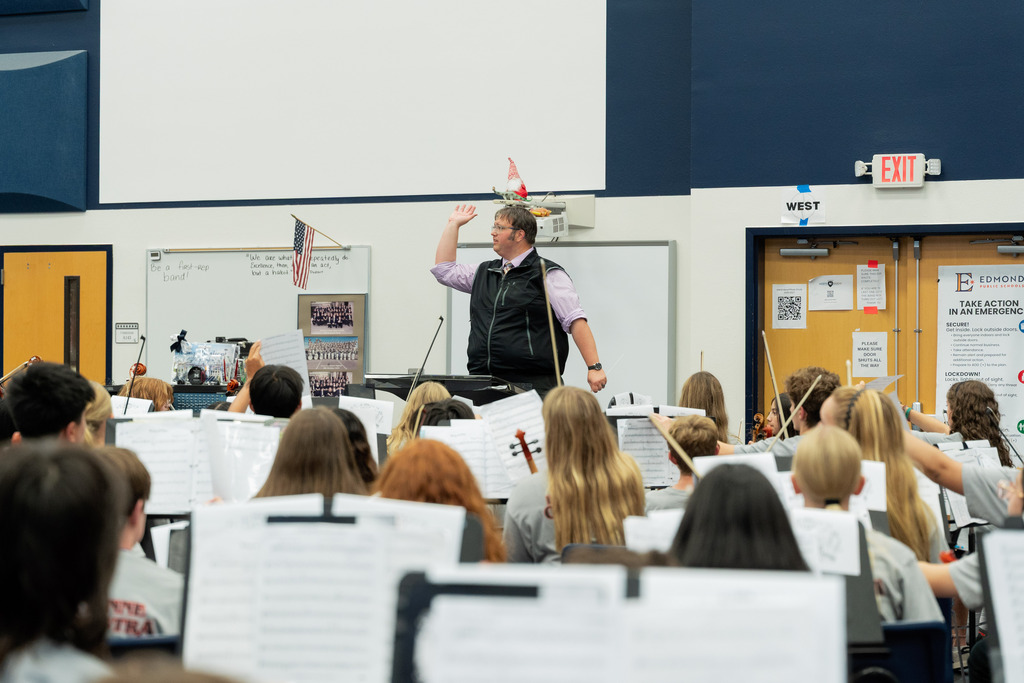 director conducting song