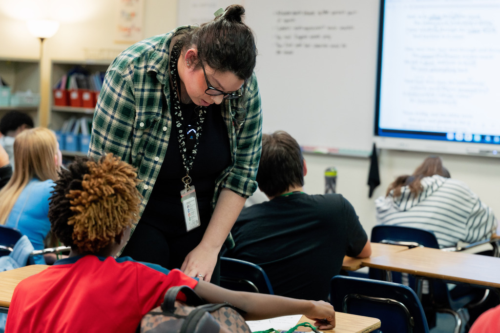teacher helping student