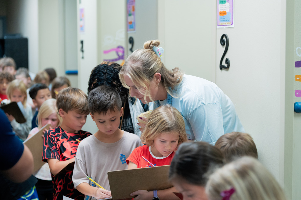 teacher helping student