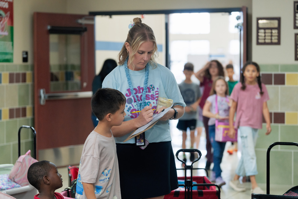 teacher helping student