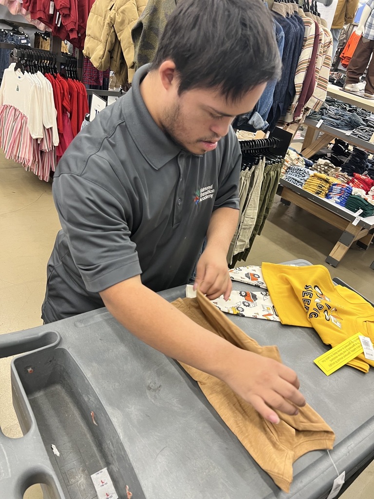 Intern folding clothes at Old Navy