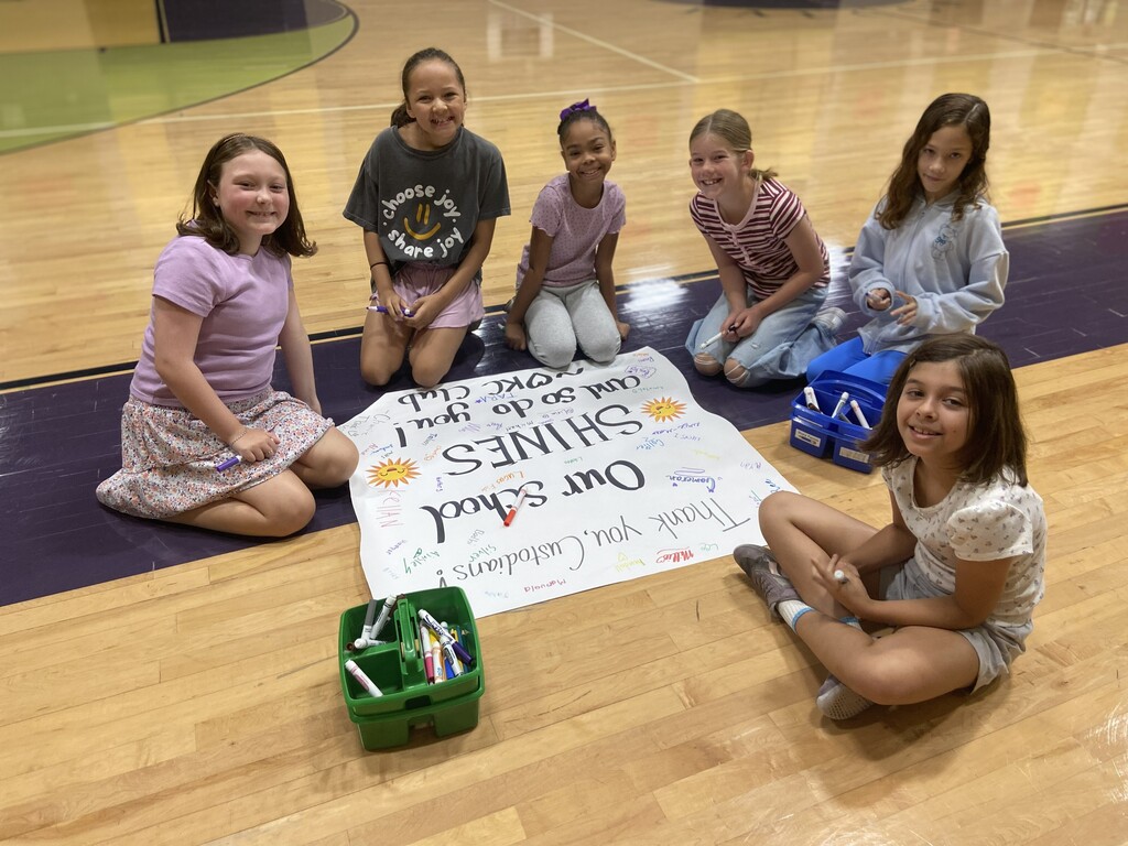 students signing appreciation poster