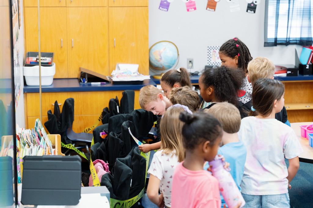 students looking at a piece of paper