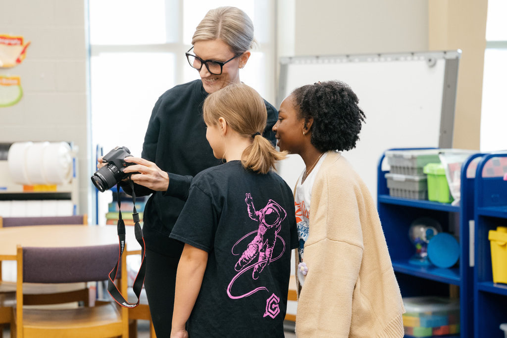 instructor showing camera to students