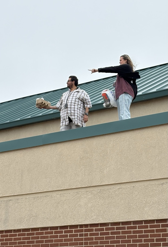 Mrs Gomez and Mr Carlos on roof 