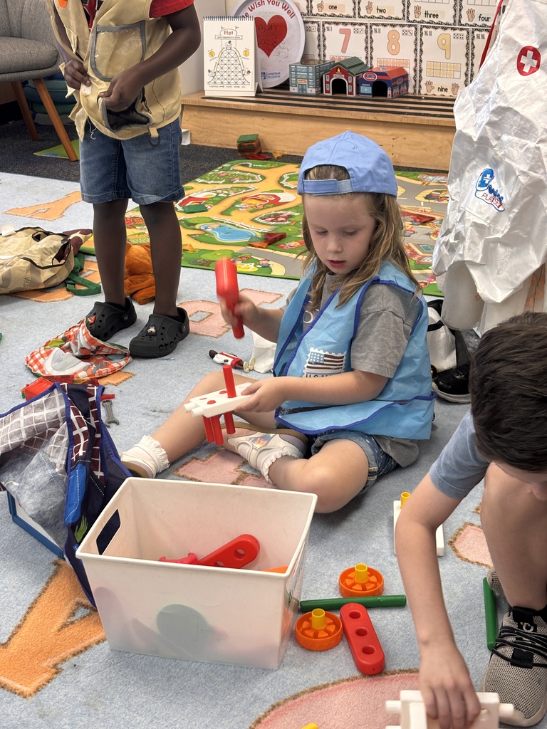 Kinder students dressed up as community helpers like firefighters, vets, and doctors. 