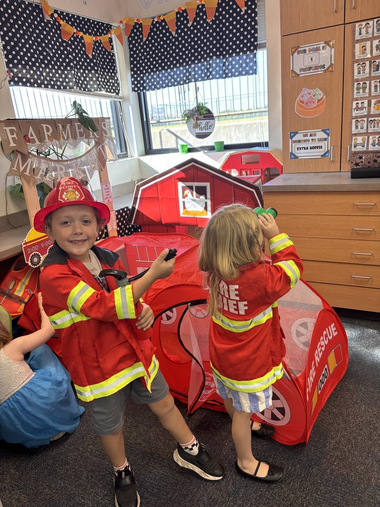 Kinder students dressed up as community helpers like firefighters, vets, and doctors. 