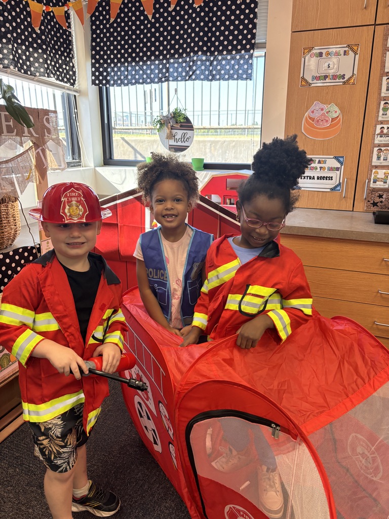 Kinder students dressed up as community helpers like firefighters, vets, and doctors. 