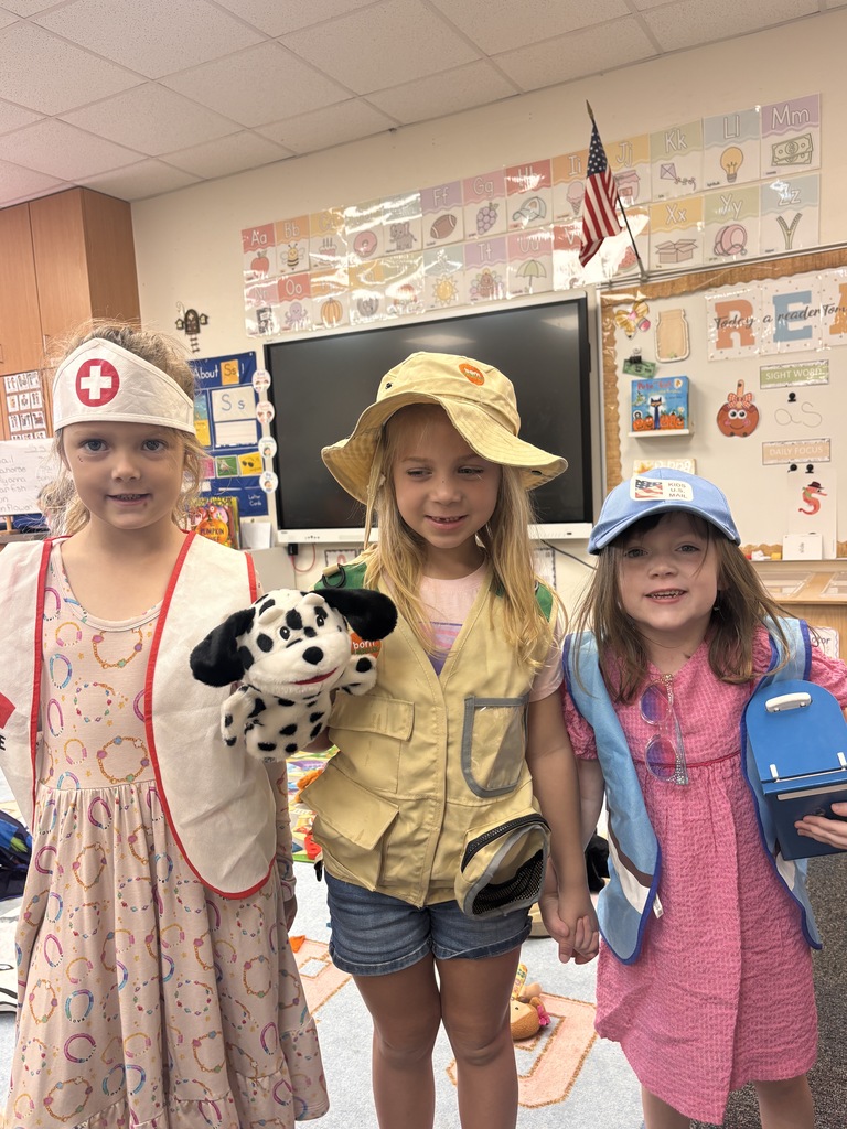 Kinder students dressed up as community helpers like firefighters, vets, and doctors. 