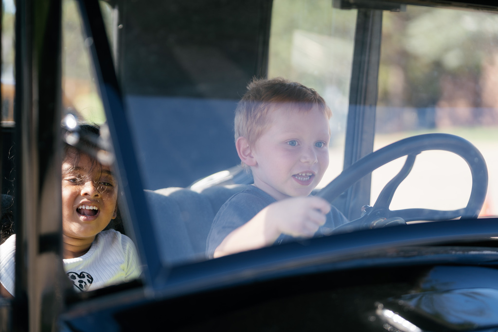 student pretend driving a truck