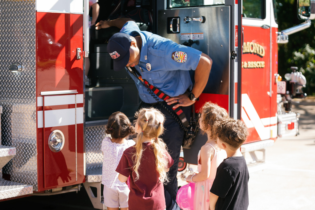 firefighter talking to students