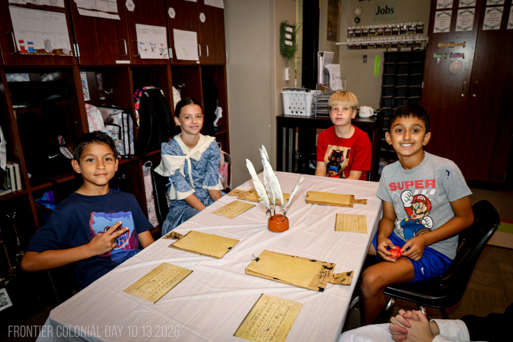 student learning to write with quills