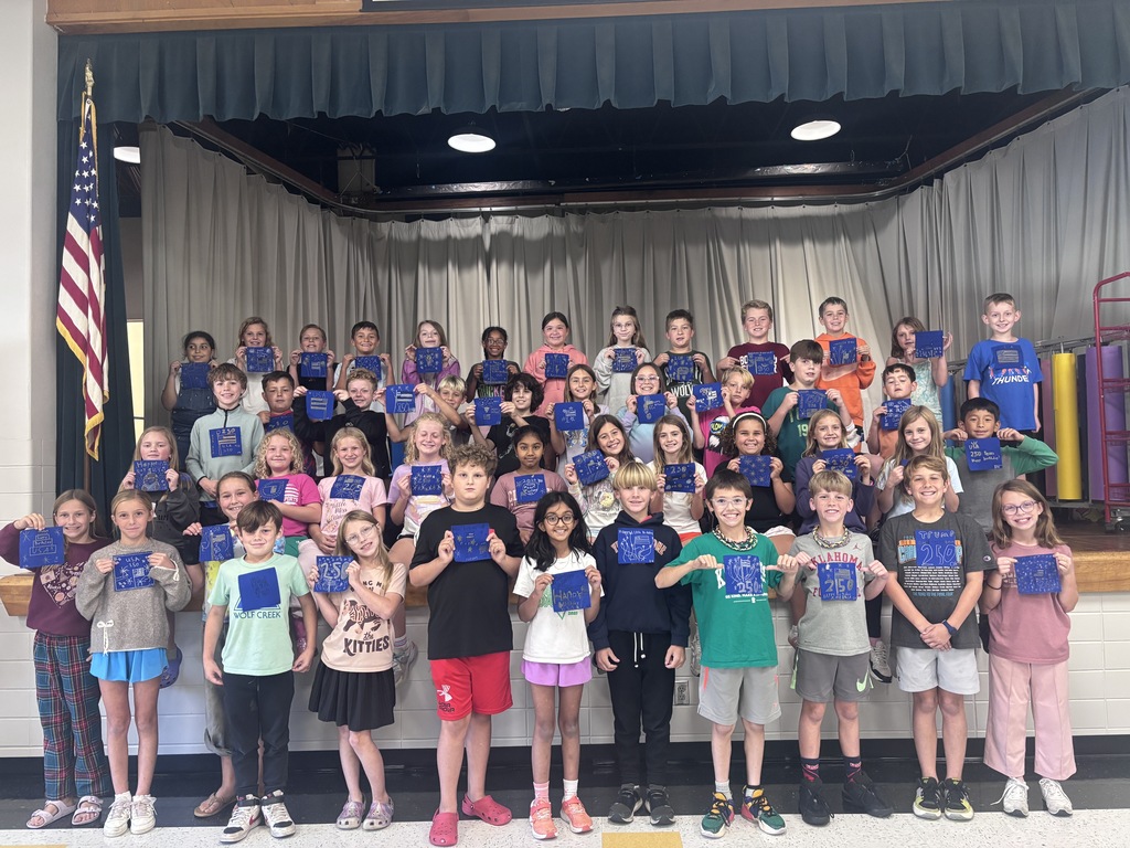 Fourth Graders holding their fabric tiles
