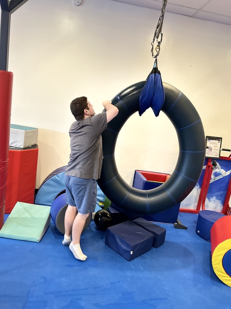 Intern cleaning the swing 