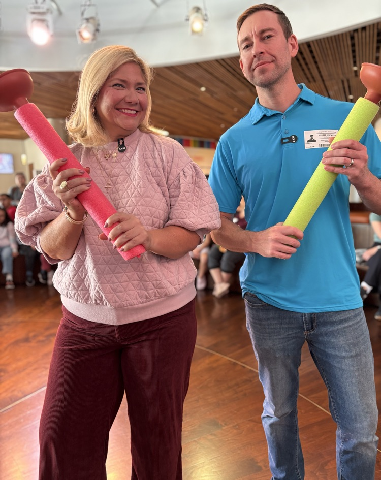parents with plungers for game 