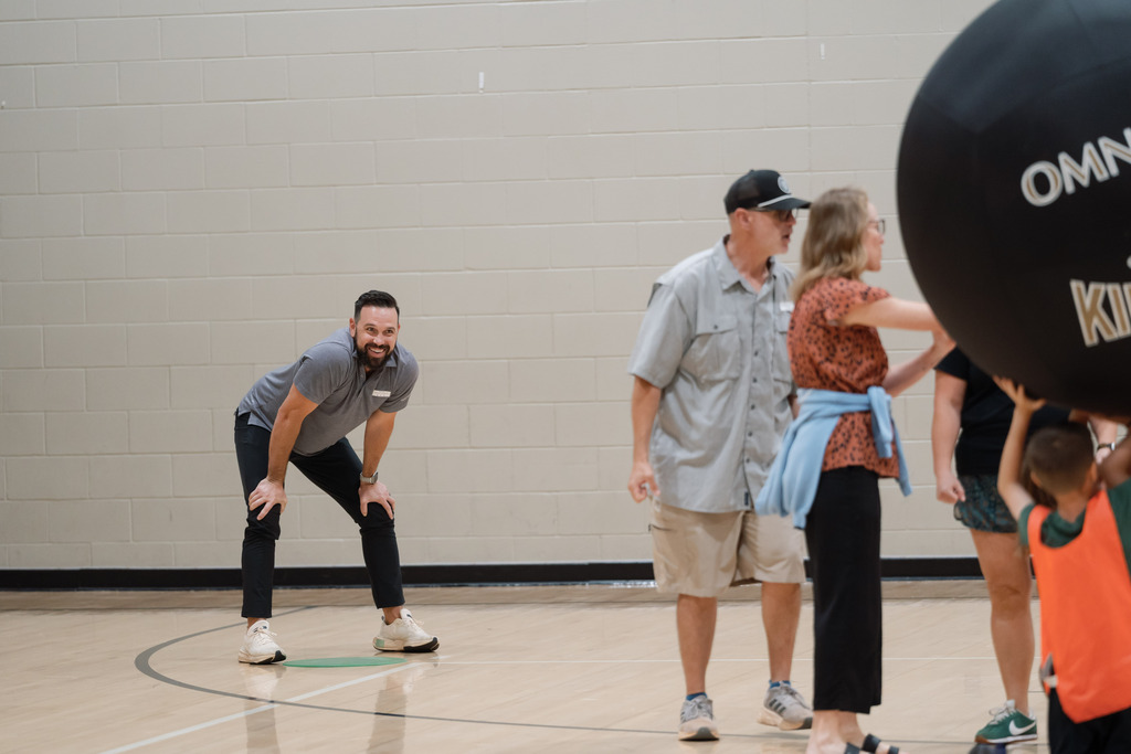 parent playing in pe with students