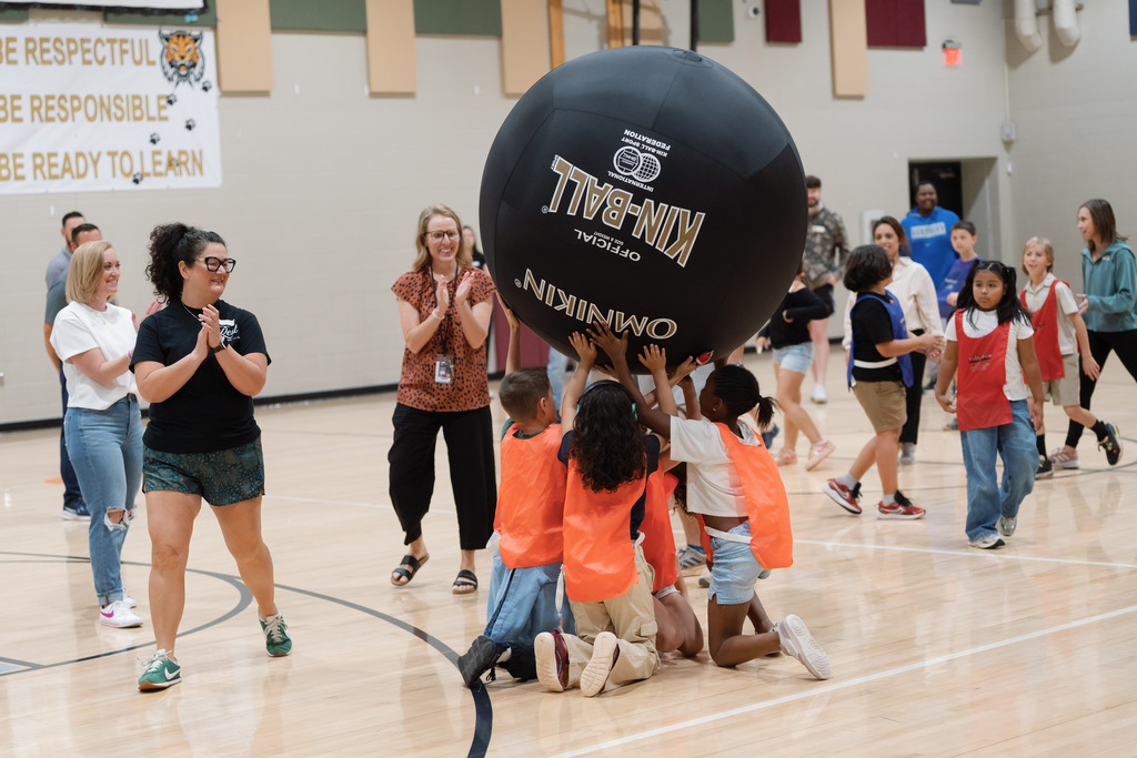 parent playing in pe with students