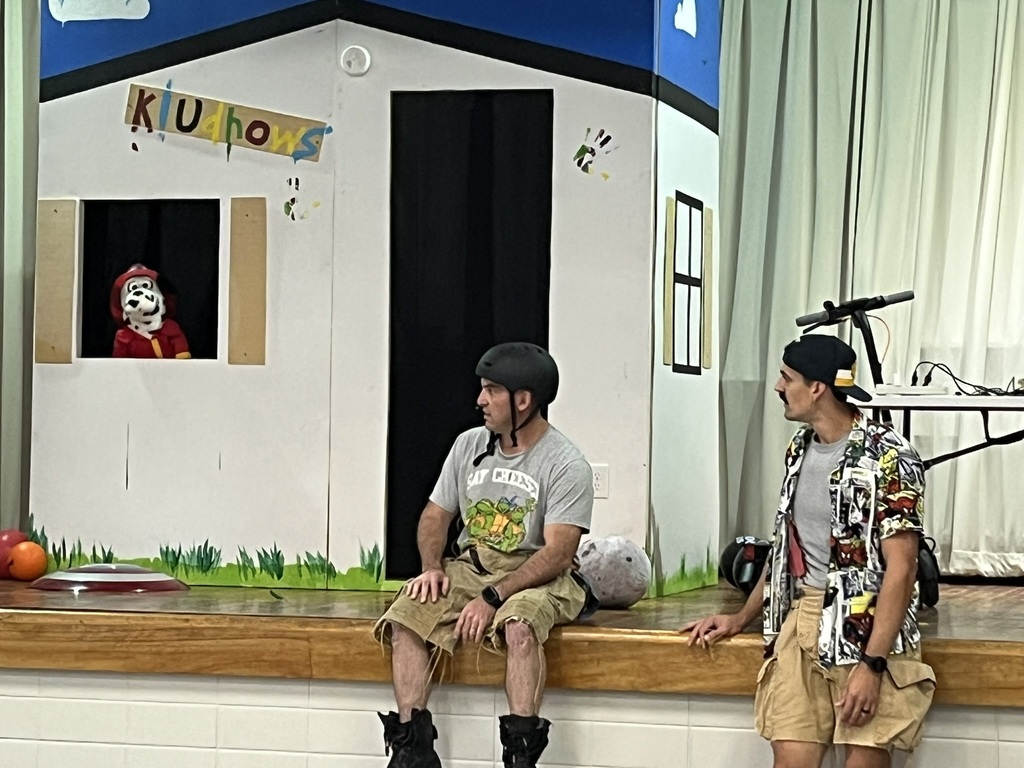 Firefighters and Sparky perform a skit