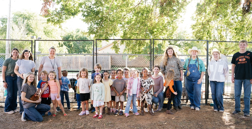 students posing with FFA students
