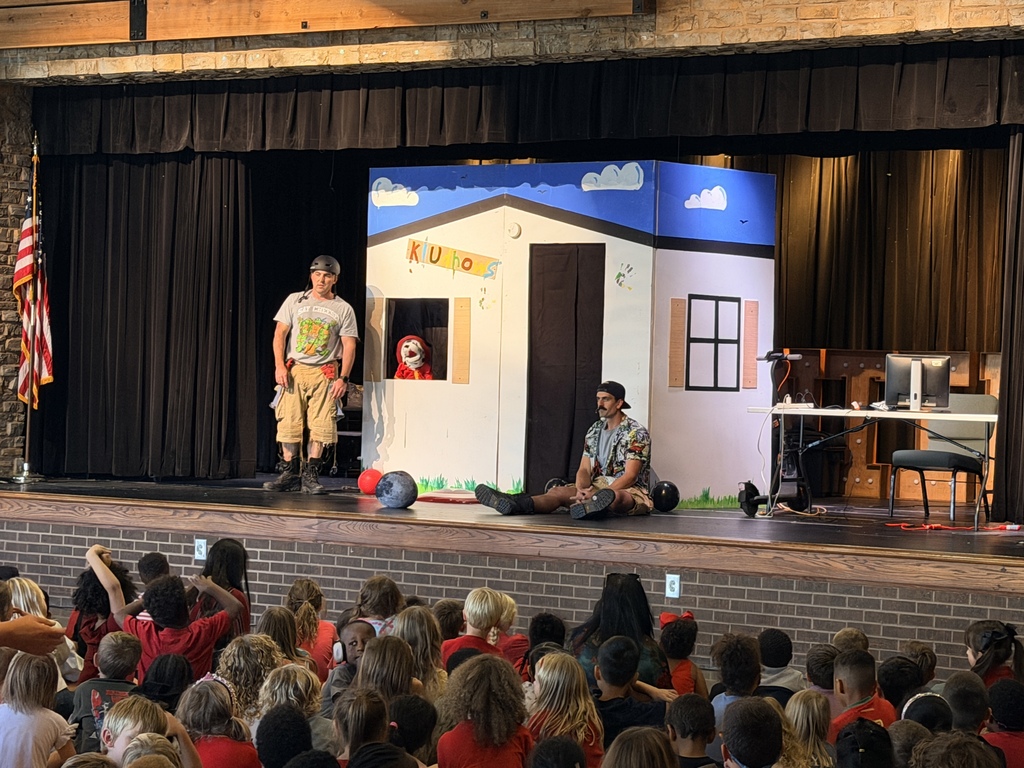 fire fighters sharing fire safety tips with the school